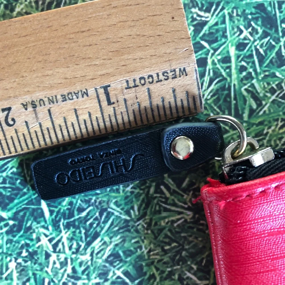 Shiseido Ginza Tokyo Red Makeup Bag with .33 oz Ultimune Deluxe Sample Included